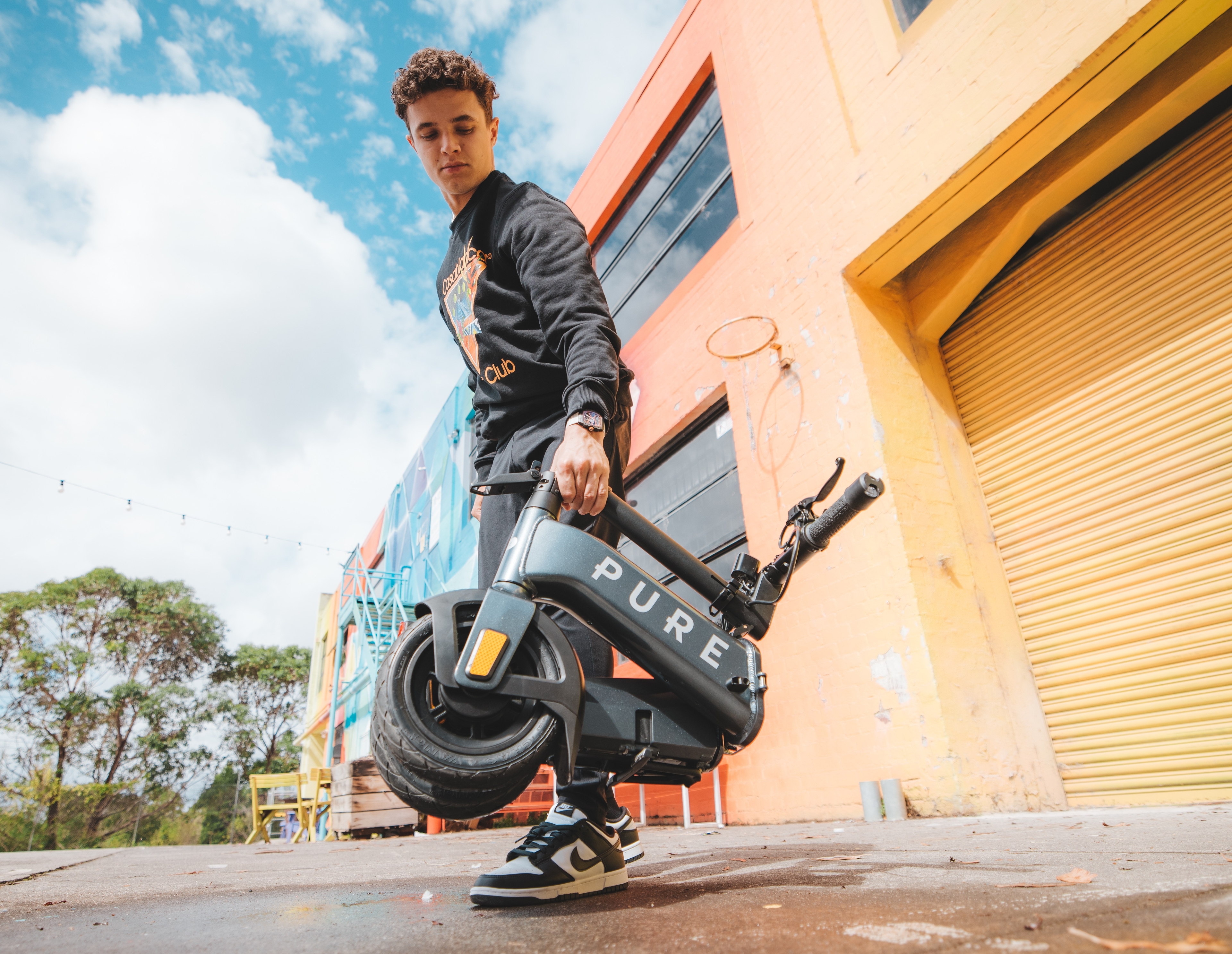 Carrying the folded Pure Flex by its handle